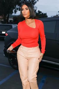 Kim Kardashian braless boobs in a sexy little top showing off her big tits seen by paparazzi out shopping.