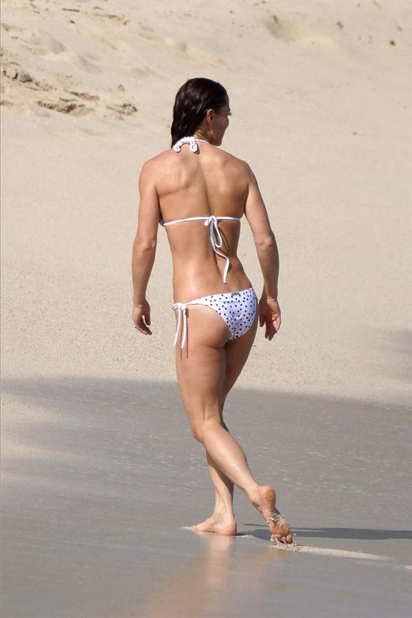 Pippa Middleton sexy ass in a bikini also showing nice cleavage with her big tits seen by paparazzi on the beach.