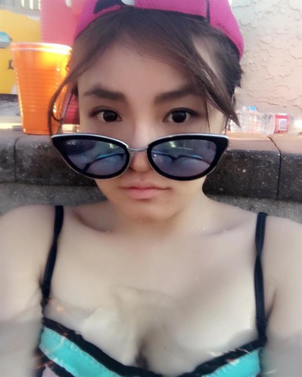 Rebecca Chen (mayuschen) in a bikini taking a selfie