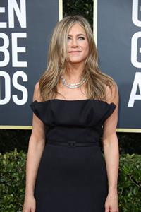 Jennifer Aniston in a sexy black dress photographed arriving to the Golden Globe Awards.