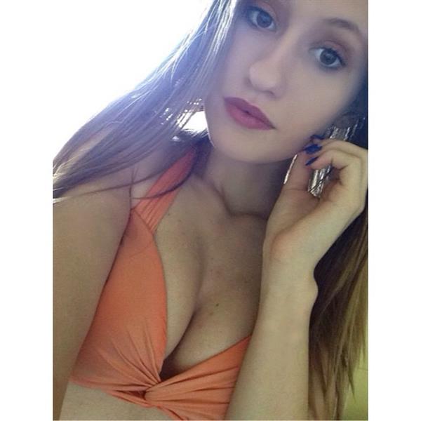 Marina Leigh in a bikini taking a selfie