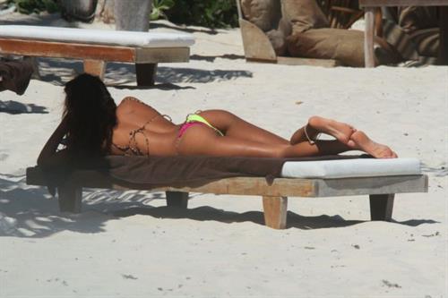 Thaila Ayala sexy ass in a thong bikini also showing nice cleavage seen by paparazzi on the beach in Mexico.