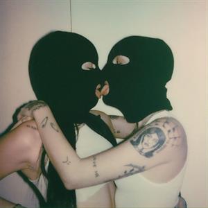 Noah Cyrus braless boobs showing nice underboob cleavage along with model Caroline Miner Smith as they make out with some nice lesbian tongue action.