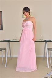 Sexy milf Roxanne has just returned from an evening show, and now the horny housewife needs to let off some steam! She slips out of her evening gown and slips a hand down her panties to discover that her landing strip twat is dripping and eager for her to get naked and use her fingers to rock her world.