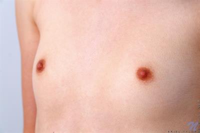 Sweet Ariel Tylor is a little bit shy about showing herself off for the camera, but as her clothes come off she gains confidence. She's a hot piece with the most succulent little nips and a flat belly that will lead your eye lower to her cum craving bare twat.