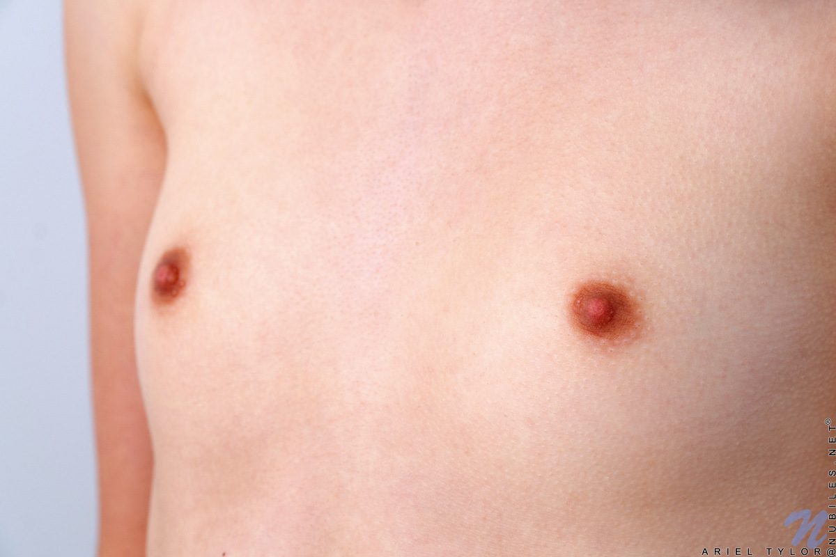 Sweet Ariel Tylor is a little bit shy about showing herself off for the camera, but as her clothes come off she gains confidence. She's a hot piece with the most succulent little nips and a flat belly that will lead your eye lower to her cum craving bare twat.