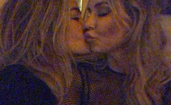 Denise Richards and Brandi Glanville lesbian kiss photo has come out showing the two kissing. Brandi has been saying they have been sleeping together and Denise has been denying it. Apparently Denise told Brandi her husband could never find out about their affair.