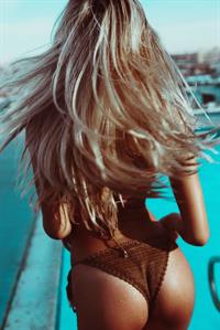 Alexis Ren in a bikini - ass