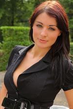  Beautiful secretary enjoys stripping out of her office outfit and posing in stockings and heels. 