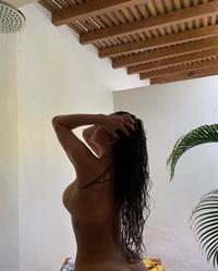 Anastasia Karanikolaou AKA Stassie poses nude again showing her topless boobs and naked ass wet stepping out of the shower.