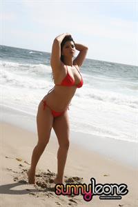 Sunny Leone wearing a red bikini