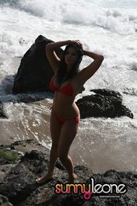 Sunny Leone wearing a red bikini