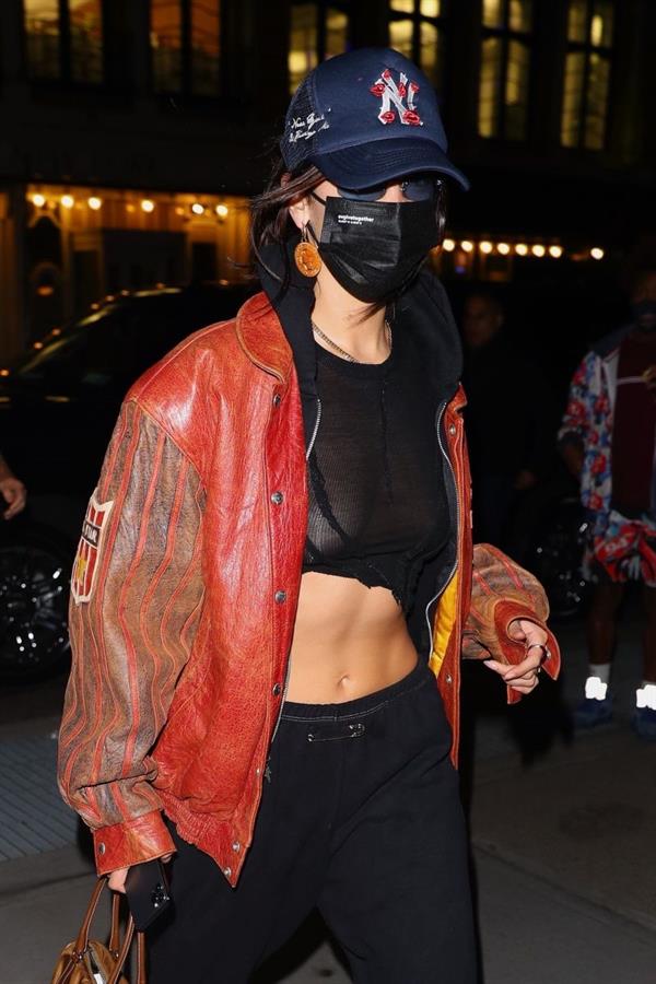 Bella Hadid braless boobs in a sexy little completely see through top showing off her big tits out in New York seen by paparazzi.