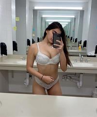 Alisha Sahi in lingerie taking a selfie
