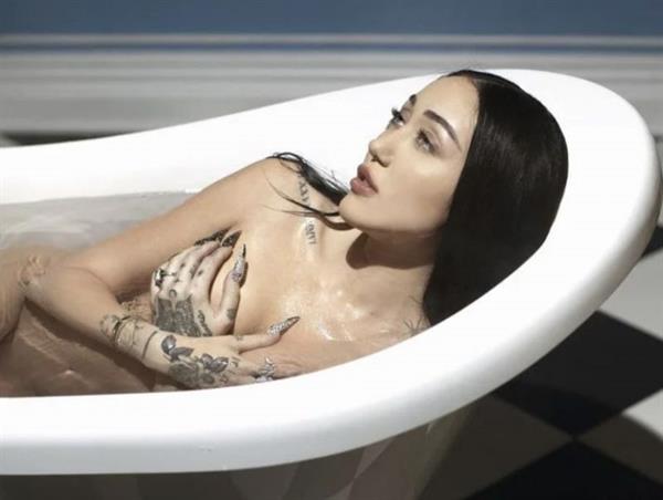 Noah Cyrus nude new photo posing fully naked in a bathtub for Forbes holding her topless big tits.
