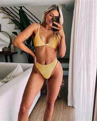 Whitney Simmons in a bikini taking a selfie