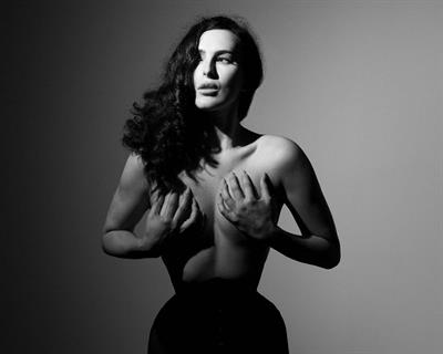 Rumer Willis nude boobs pics from a new photoshoot in black and white holding her topless big tits.
