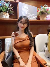 Busty girl in posh dress.