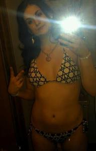 Luna Phoenix in a bikini taking a selfie