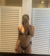 Alicia Manrique in a bikini taking a selfie