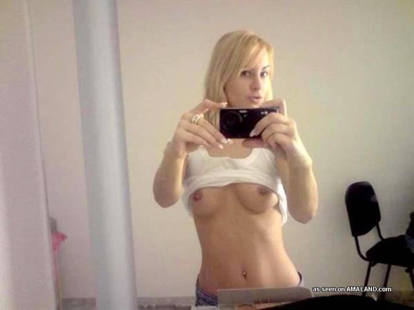 Anonymous taking a selfie and - breasts