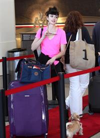 Krysten Ritter - Prepares to leave LAX in Los Angeles, California - June 8, 2012 