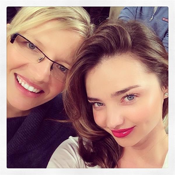 Miranda Kerr taking a selfie
