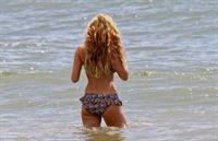 Kelly Brook in a bikini - ass