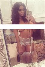Courtnie Quinlan in lingerie taking a selfie