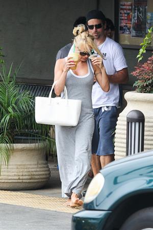 Pamela Anderson leaves barefoot a local Restaurant with a friend in Malibu July 6, 2013 