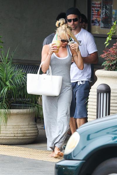 Pamela Anderson leaves barefoot a local Restaurant with a friend in Malibu July 6, 2013 